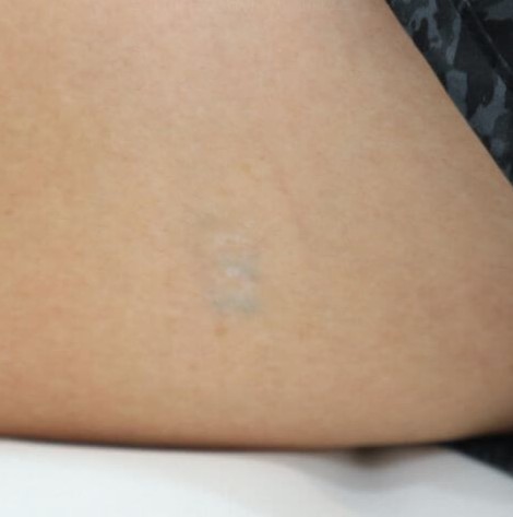 barely visible Nike tattoo