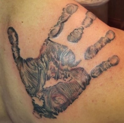 Tattoo of a detailed handprint