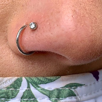stud and ring nostril piercing