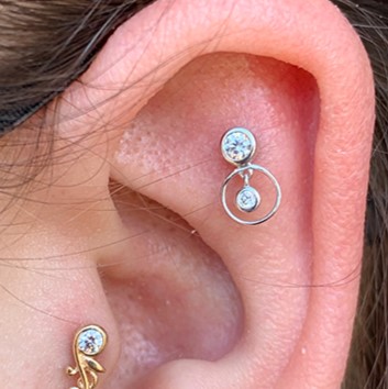 helix and tragus ear piercings