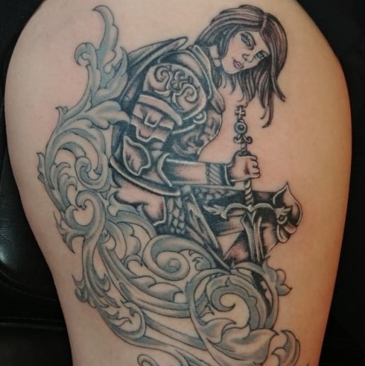 Tattoo of gladiator woman surrounded by waves