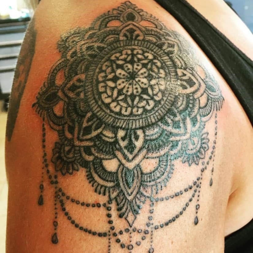Tattoo of a henna-inspired dreamcatcher